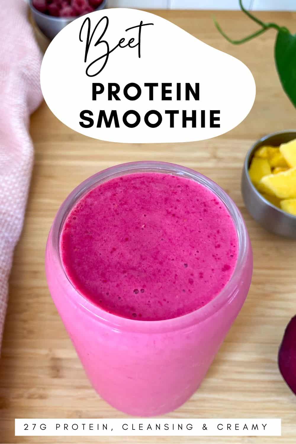 Bright pink beet protein smoothie in a clear glass with text overlay reading “Beet Protein Smoothie – 27g Protein, Cleansing & Creamy.” A refreshing, antioxidant rich high protein smoothie with beets, raspberries, and mango for liver health.