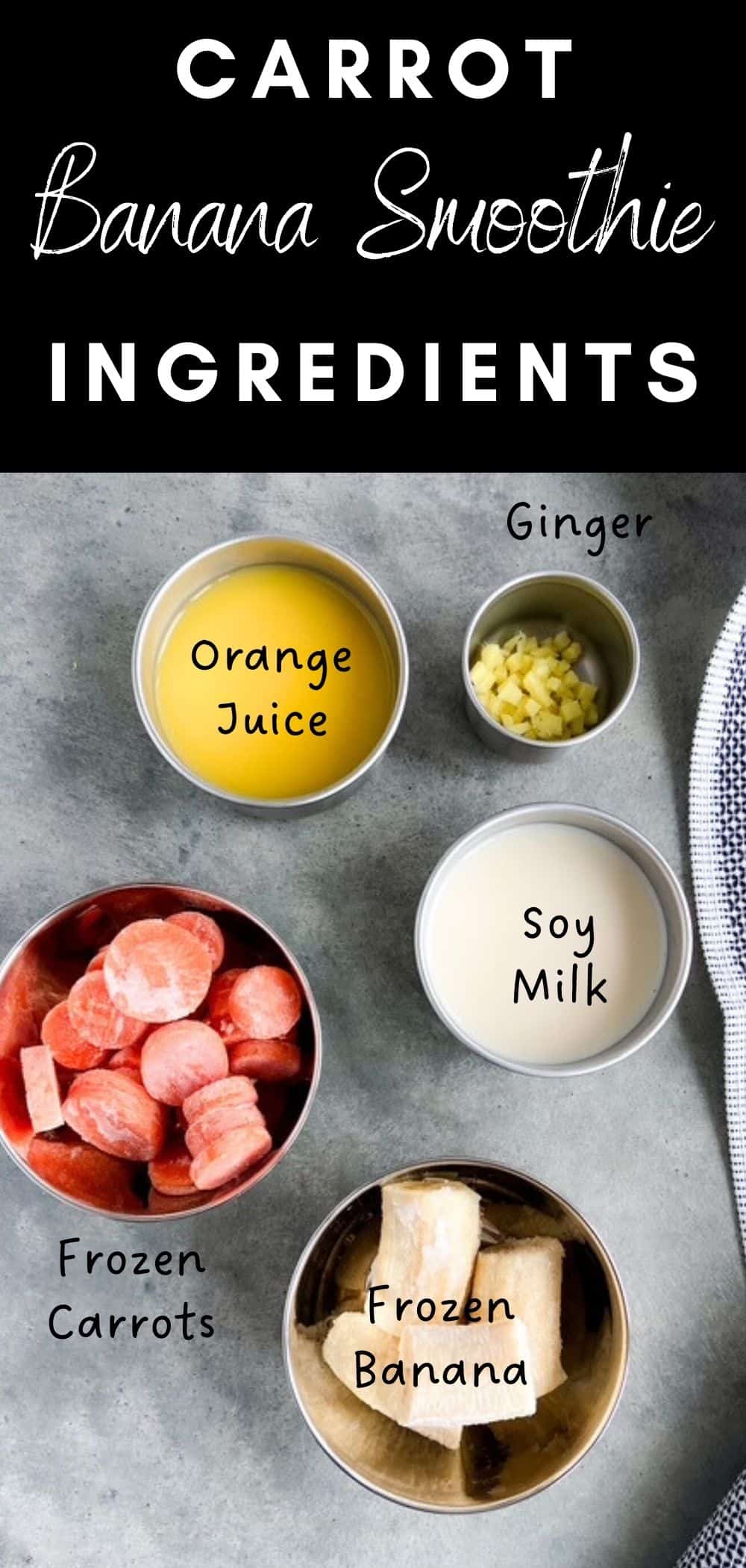 Overhead view of carrot banana smoothie ingredients including frozen carrots, frozen banana, soy milk, orange juice, and chopped ginger in small bowls on a gray surface.