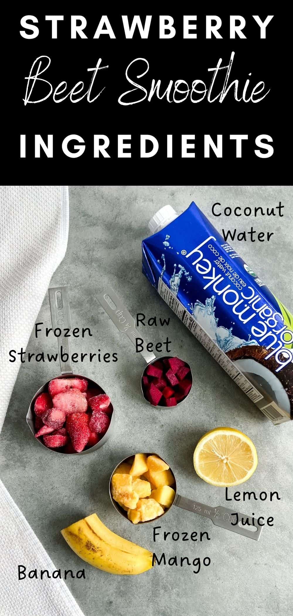Flat lay of strawberry beet smoothie ingredients including frozen strawberries, raw beets, mango, banana, lemon juice, and coconut water on a gray surface.